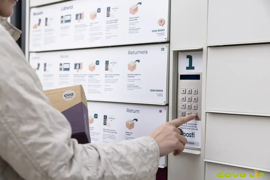 User operating the custom keypad and display on an outdoor parcel locker
